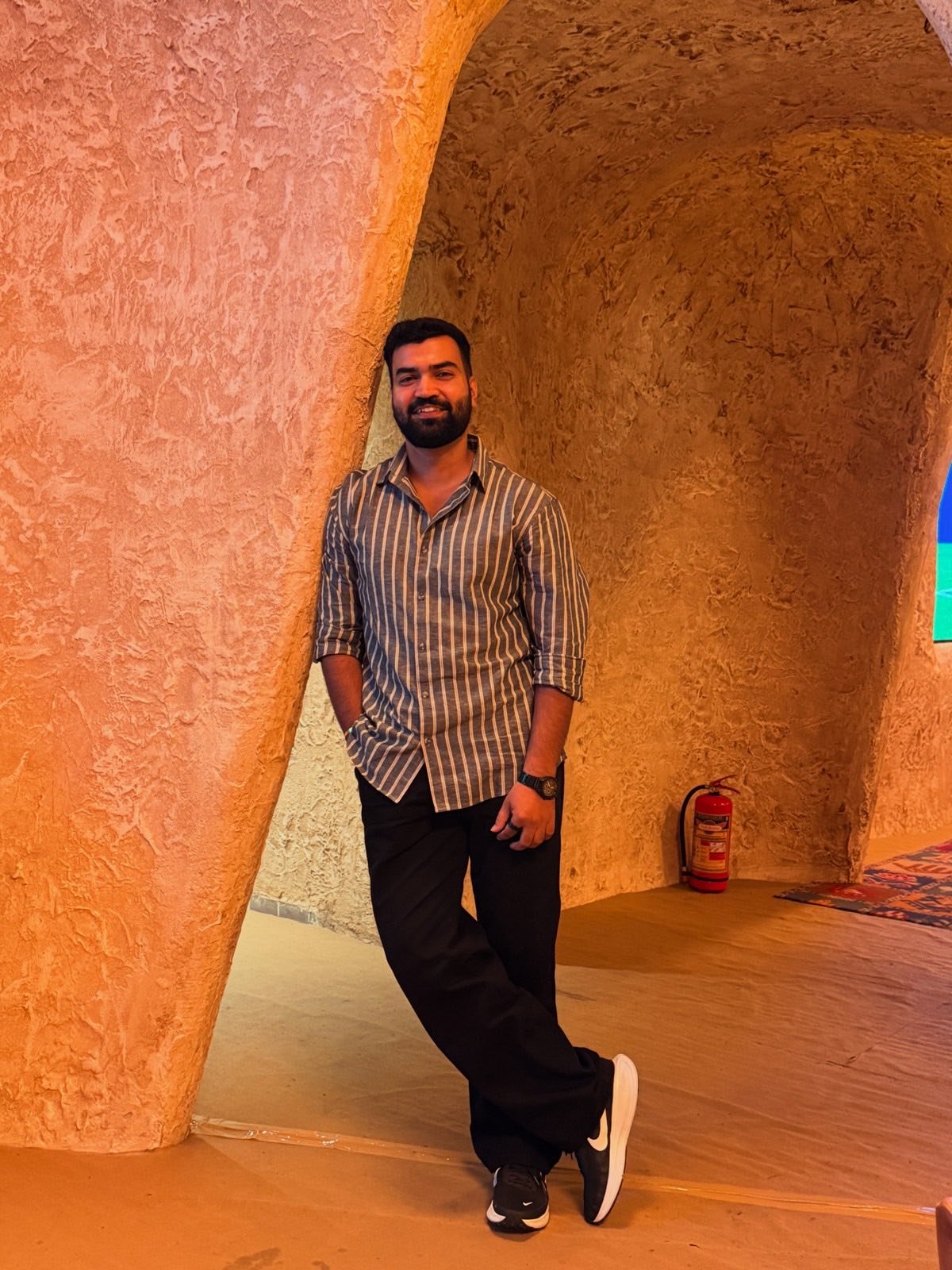 Rishav in a sandstone corridor